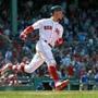 Boston, MA: 5-2-18: The Red Sox Mookie Betts (50) rounds first base as he watches his bottom of the 7th inning home run,his third round tripper of hte game leave the yard. The Boston Red Sox hosted the Kansas City Royals in a regular season MLB baseball game at Fenway Park. (Jim Davis/Globe Staff)