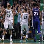 Boston, MA: 5-3-18: When the Celtics Jayson Tatum (0) came down after hanging around the rim after his slam dunk on a nice feed from teamamte Terry Rozier III (not pictured) bringing the crowd out of their seats, teammate Marcus Morris (13) howls in delight. The shot gave Boston a 103-97 lead, on their way to a 108-103 victory. Marcus Morris howls at left. The 76ers Joel Embiid (21) and the Celtics Al Horford (12) are at right. The Boston Celtics hosted the Philadelphia 76ers in Game Two of their NBA Eastern Conference Semi Final playoff series at the TD Garden. (Jim Davis/Globe Staff)