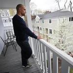 Christopher Love stood on the porch of his home, overlooking the parking area where he was arrested.