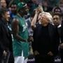 Left to right, Celtics owner Wyc Grousbeck, Gucci Mane, New England Patriots owner Robert Kraft, and Meek Mill are pictured together during a timeout during the Thursday?s game. 