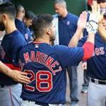 ARLINGTON, TX - MAY 04: J.D. Martinez #28 of the Boston Red Sox is congratulated for hitting a hits a solo home run in the first inning against the Texas Rangers at Globe Life Park in Arlington on May 4, 2018 in Arlington, Texas. (Photo by Rick Yeatts/Getty Images)