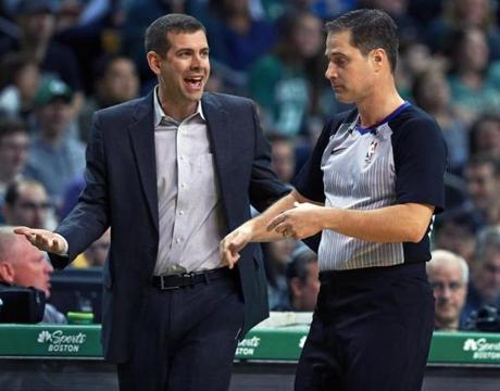 Boston, MA: 3/11/2018: Celtics head coach Brad Stevens (left) argues a first half call with a referee to no avail. The Boston Celtics hosted the Indiana Pacers in a regular season NBA basketball game at the TD Garden. (Jim Davis/Globe Staff)
