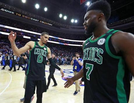 Philadelphia, PA: 5-5-18: The Celtics Jayson Tatum (left) and Jaylen Brown (right) congratulate each other following the overtime Boston victory. The Boston Celtics visited the Philadelphia 76ers in Game Three of their NBA Eastern Conference Semi Final playoff series at the Wells Fargo Center. (Jim Davis/Globe Staff)
