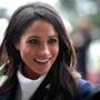 (FILES) In this file photo taken on March 8, 2018 Britain's Prince Harry's fiancee US actress Meghan Markle greets well-wishers as she arrives with the prince at Millennium Point to attend an event hosted by social enterprise Stemettes to celebrate International Women's Day in Birmingham. Raised in Hollywood, she graduated from Northwestern University in theatre and international relations. She made her name starring as Rachel Zane in the US legal drama television series 