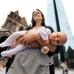 Rebecca Zanconato of Sutton held her 7-week-old daughter Leah as she listened to a speaker in Copley Square in Boston on Sunday.
