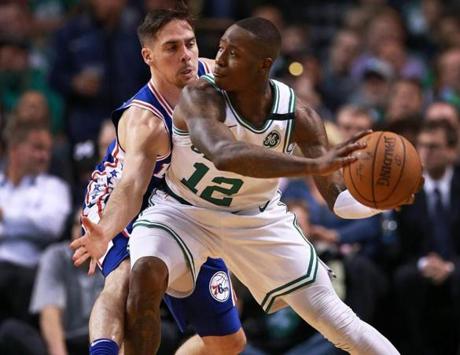 Boston, MA: 5-8-18: The Celtics Terry Rozier III looks for a pass as the 76ers T.J. McConnell defends, first half action. The Boston Celtics hosted the Philadelphia 76ers for Game Five of their NBA Eastern Conference Semi Final Playoff series at the TD Garden. (Jim Davis/Globe Staff)
