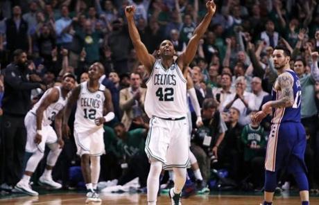 Boston, MA: 5-8-18: The Celtics Al Horford (42) starts the celebration after Boston;s 114-112 victory. The Boston Celtics hosted the Philadelphia 76ers for Game Five of their NBA Eastern Conference Semi Final Playoff series at the TD Garden. (Jim Davis/Globe Staff)
