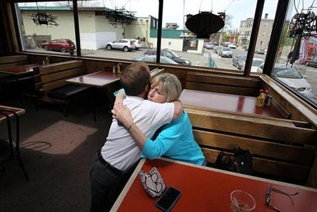 Allston, MA., 05/11/18, The Bus Stop Pub owner, Joyce Hynds, cq, gets a good bye hug from long time customer Mark Lydon. The Bus Stop Pub, an Allston neighborhood bar, is closing after 38 years, squeezed out by Harvard University's massive expansion into North Allston and the simultaneous gentrification of the blue-collar neighborhood. Suzanne Kreiter/Globe staff
