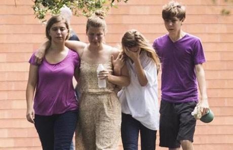 TEXAS SHOOTING SLIDER Students are emotional as they gather by the Barnett Intermediate School where parents are gathering to pick up their children following a shooting at Santa Fe High School on Friday, May 18, 2018, in Santa Fe, Texas. (Marie D. De Jesus/Houston Chronicle via AP)
