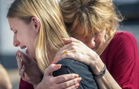 TEXAS SHOOTING SLIDER Santa Fe High School student Dakota Shrader is comforted by her mother Susan Davidson following a shooting at the school on Friday, May 18, 2018, in Santa Fe, Texas. Shrader said her friend was shot in the incident. (Stuart Villanueva/The Galveston County Daily News via AP)
