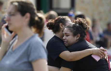 TEXAS SHOOTING SLIDER Santa Fe High School junior Guadalupe Sanchez, 16, cries in the arms of her mother, Elida Sanchez, after reuniting with her at a meeting point at a nearby Alamo Gym fitness center following a shooting at Santa Fe High School in Santa Fe, Texas, on Friday, May 18, 2018. (Michael Ciaglo/Houston Chronicle via AP)
