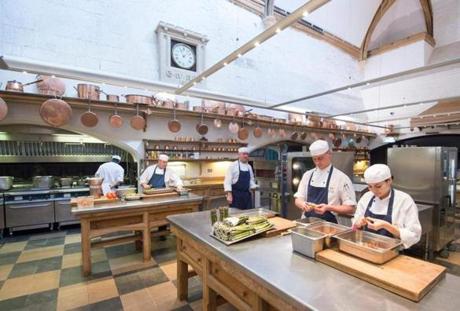 Kitchen staff work in the Royal Kitchen at Windsor Castle in Windsor as they begin preparations for the wedding banquet for the marriage ceremony of Britain's Prince Harry and Meghan Markle.  
