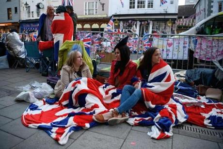 Royal fans wake and prepare themselves, as media, tourists, and royal fans gather near Windsor Castle on Saturday.
