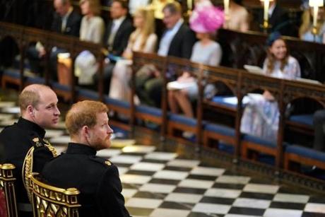Britain Prince Harry, second left sits with his best man and brother Prince William, the Duke of Cambridge, during the wedding ceremony of Prince Harry and Meghan Markle at St. George?s Chapel in Windsor Castle in Windsor, near London, England, Saturday, May 19, 2018. (Dominic Lipinski/pool photo via AP)
