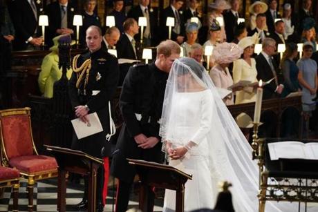 Britain?s Prince Harry and Meghan Markle arrive at the High Altar for their wedding ceremony.
