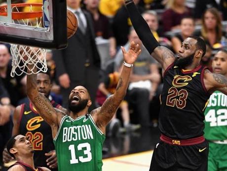 CLEVELAND, OH - MAY 19: Marcus Morris #13 of the Boston Celtics battles for the ball with LeBron James #23 of the Cleveland Cavaliers in the first half during Game Three of the 2018 NBA Eastern Conference Finals at Quicken Loans Arena on May 19, 2018 in Cleveland, Ohio. NOTE TO USER: User expressly acknowledges and agrees that, by downloading and or using this photograph, User is consenting to the terms and conditions of the Getty Images License Agreement. (Photo by Jason Miller/Getty Images)
