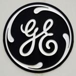 (FILES)This file photo shows the GE logo on a sign outside the corporate headquarters of the General Electric company, in Fairfield, Connecticut. General Electric reported lower second-quarter earnings on July 21, 2017 following a mixed performance of its industrial division as outgoing chief executive Jeff Immelt prepares to step down.Net income was $1.2 billion, down 57 percent from the year-ago period. Revenues fell 11.8 percent to $29.6 billion. The results in the 2016 period were boosted by the inclusion of appliances assets that have since been sold. / AFP PHOTO / STAN HONDASTAN HONDA/AFP/Getty Images