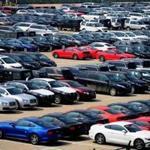 Imported cars awaited distribution while sitting in a lot in Qingdao, China. Beijing said Tuesday it will reduce auto import duties effective July 1.