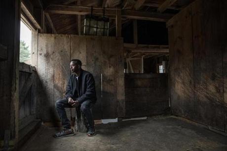 Abdi Nor Iftin in the Maine barn where he cared for horses and chopped wood.
