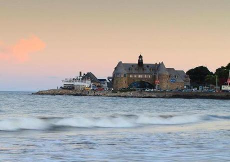 A view of (from left) the Coast Guard House and the Towers from the sea wall near Town Beach in Narragansett, R.I.
