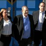 Harvey Weinstein is led in handcuffs from a New York City precinct to court to face charges of rape and sexual assault.  