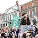 A woman who backed overturning Ireland?s strict abortion regulations celebrated Saturday in Dublin after the results were announced.