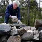Bill Doherty, 84, hauls hefty rocks to build or restore walls. 