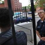 Boston Police Officer Jorge Dias chatted with two youths at the Mildred C. Hailey Apartments in Jamaica Plain.