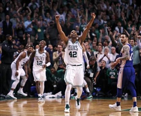 Al Horford (42) starts the celebration after the Boston Celtics? 114-112 playoff victory over the Philadelphia 76ers.
