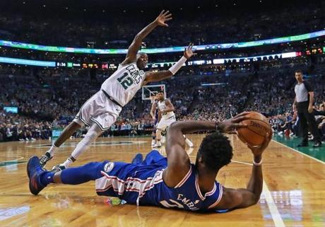 The Boston Celtics? Terry Rozier leaps to try to block a pass from the 76ers Joel Embiid,during action at TD Garden in the NBA Eastern Conference semifinal playoff series.
