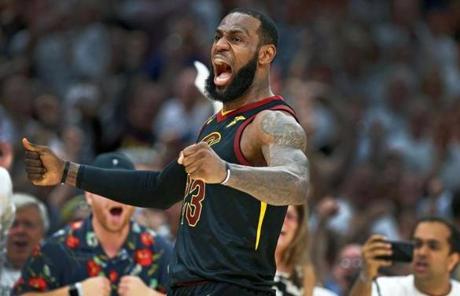 LeBron James reacts after hitting a three pointer late in the game to give Cleveland a 107-96 lead, on their way to a 109-99 victory in Cleveland.
