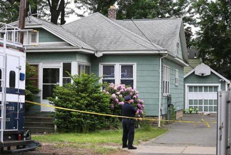 Springfield- 06/01/18- The right front of the house. Investigators continued to work at the home and yard of Stuart Weldon on Page Blvd. where three bodies were discovered. Photo by John Tlumacki/Globe Staff(metro)
