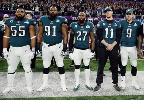 Members of the Eagles stood for the national anthem at the Super Bowl in February.
