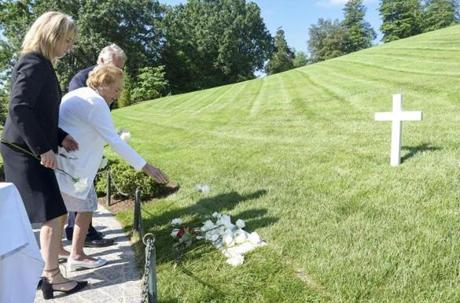 Ethel Kennedy, flanked by her children Rory and Christopher, placed flowers on the marble tombstone marking the grave of her husband, Robert F. Kennedy, Wednesday in Arlington National Cemetery. 
