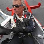 BOSTON, MA - 6/07/2018: Putting on his flight gloves while in the cockpit at Norwood Airpot, Sean D. Tucker's final season as a SOLO act. He will be performing his Sky Dance air routine just one more time this year before working on a performance team. Sean has been performing for 42 years. He is 66 years old, an honorary Blue Angel, Thunderbird, Golden Knight, just about every accolade for aerobatics performance on record. (David L Ryan/Globe Staff ) SECTION: METRO TOPIC 07pilot