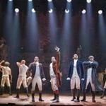 Lin-Manuel Miranda (raising his arm) and the rest of the Broadway cast of the musical ?Hamilton? onstage at the Richard Rodgers Theater in New York in 2015. 