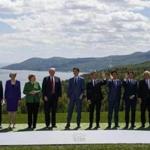 From left, President of the European Council Donald Tusk, British Prime Minister Theresa May, German Chancellor Angela Merkel, U.S. President Donald Trump, Canadian Prime Minister Justin Trudeau, French President Emmanuel Macron, Japanese Prime Minister Shinzo Abe, Italian Prime Minister Giuseppe Conte and President of the European Commission Jean-Claude Juncker gather for the family photo at the G-7 summit, Friday, June 8, 2018, in Charlevoix, Canada. (AP Photo/Evan Vucci)