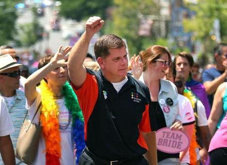 Boston-06/10/2017- The annual Pride Parade made it's way through Boston streets as Boston Mayor Marty Walsh salutes the spectators on Beacon Street./The Boston Globe(metro)
