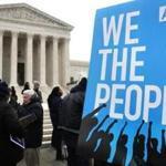 People rallied outside of the Supreme Court in opposition to Ohio's voter roll purges in Washington. 