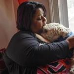 Amarilys Martinez held her dog Nikko in Nashua, N.H., on Wednesday after they were reunited.