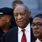 FILE - In this April 26, 2018 file photo, Bill Cosby, center, leaves the the Montgomery County Courthouse in Norristown, Pa. Cosby will be sentenced on Sept. 24, five months after he was convicted of sexual assault. Judge Steven O'Neill set the date on Tuesday, May 15, 2018. Cosby's lawyers had asked to delay sentencing until December. (AP Photo/Matt Slocum, File)