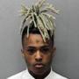 This 2017 arrest photo made available by the Miami Dade Dept. of Corrections shows Jahseh Onfroy, also known as the rapper XXXTentacion, under arrest. Onfroy was shot and killed, Monday, June 18, 2018, in Deerfield Beach, Fla. (Miami Dade Dept of Corrections via AP)
