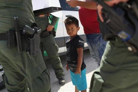 MISSION, TX - JUNE 12: U.S. Border Patrol agents take into custody a father and son from Honduras near the U.S.-Mexico border on June 12, 2018 near Mission, Texas. The asylum seekers were then sent to a U.S. Customs and Border Protection (CBP) processing center for possible separation. U.S. border authorities are executing the Trump administration's zero tolerance policy towards undocumented immigrants. U.S. Attorney General Jeff Sessions also said that domestic and gang violence in immigrants' country of origin would no longer qualify them for political-asylum status. (Photo by John Moore/Getty Images)
