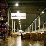 FILE-- A worker inside the Wayfair distribution center in Cranbury, N.J., April 13, 2017. Internet retailers can be required to collect sales taxes in states where they have no physical presence, the Supreme Court ruled on June 21, 2018. State officials in South Dakota sued three online retailers, including Wayfair, for violating a law that required merchants to collect sales tax. (John Taggart/The New York Times)