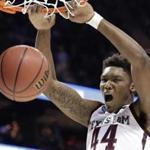 Texas A&M's Robert Williams dunks against Providence during the second half of a first-round game in the NCAA men's college basketball tournament in Charlotte, N.C., Friday, March 16, 2018. (AP Photo/Gerry Broome)