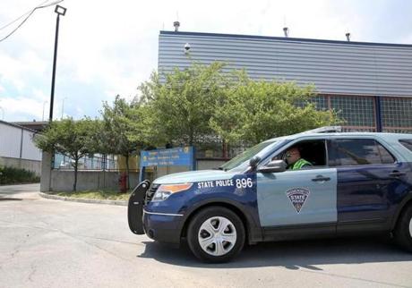A state trooper drove away from Emergency Response Station 10 in a Charlestown industrial park. 

