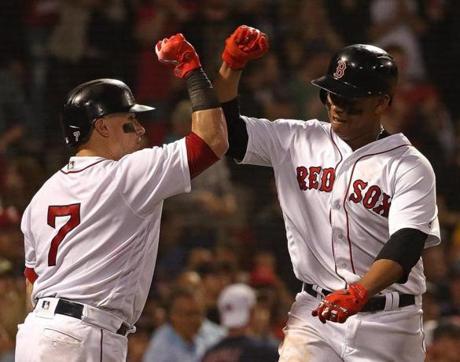 Boston, MA - 6/28/2018 - (5th inning) Boston Red Sox third baseman Rafael Devers (11) celebrates with Boston Red Sox catcher Christian Vazquez (7) after his solo home run tied the game at 1-1 in the fifth inning. The Boston Red Sox host the Los Angeles Angels at Fenway Park. - (Barry Chin/Globe Staff), Section: Sports, Reporter: Peter Abraham, Topic: 29Red Sox-Angels, LOID: 8.4.2374557009.
