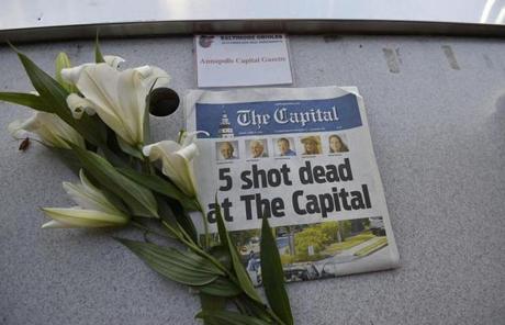 A memorial for Capital Gazette sports writer John McNamara was displayed at a seat in the press box before a baseball game between the Baltimore Orioles and the Los Angeles Angels on Friday in Baltimore.
