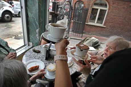 Boston, MA., 06/27/18, In the North End, at Caffe Vittoria, Fran Tortorici, cq, right, gathers with her three sisters for coffee. She says regarding the arrival of Starbucks to Hanover Street, 