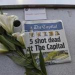 A memorial for Capital Gazette sports writer John McNamara was displayed at a seat in the press box before a baseball game between the Baltimore Orioles and the Los Angeles Angels on Friday in Baltimore.